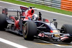 Sebastian Vettel, Scuderia Toro Rosso STR03 crosses the line to win his first GP