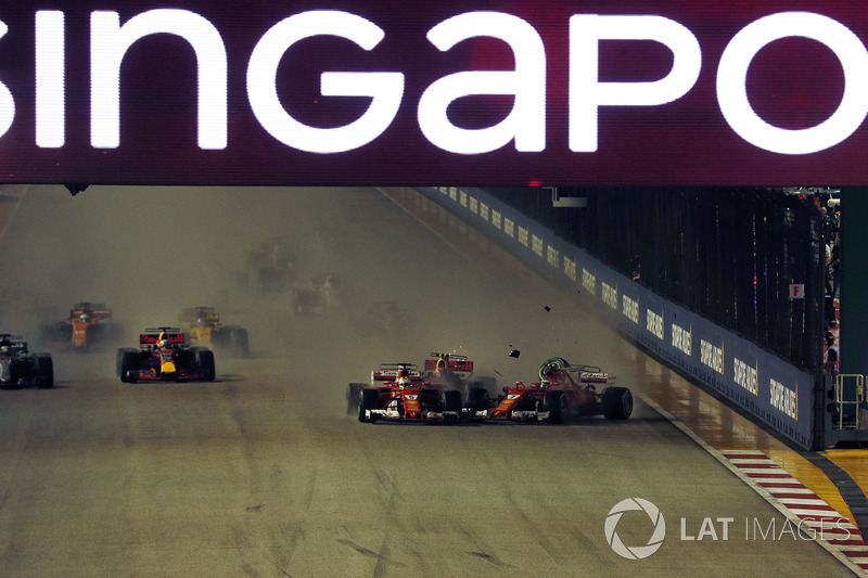 Sebastian Vettel, Ferrari SF70H leads at the start of the race and the cars of Kimi Raikkonen, Ferrari SF70H and Max Verstappen, Red Bull Racing RB13 crash after colliding