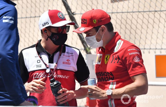 Kimi Raikkonen, Alfa Romeo Racing, and Charles Leclerc, Ferrari