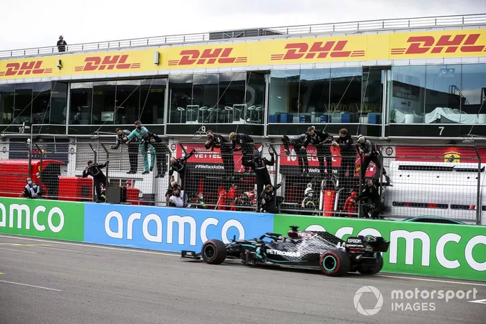 Race Winner Lewis Hamilton, Mercedes F1 W11 EQ crosses the finish line
