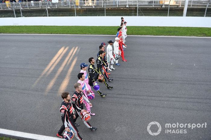 The drivers walk along the track