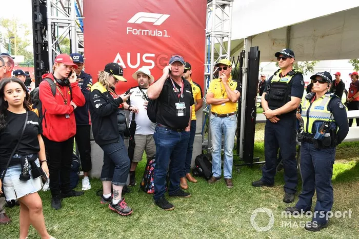 Fans queue with Police as the gates are delayed in opening