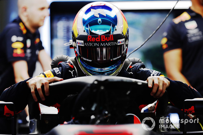 Daniel Ricciardo, Red Bull Racing RB14, climbs in his car in the garage