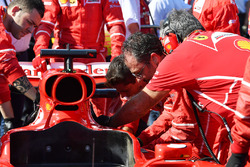Ferrari mechanics work on the car of Sebastian Vettel, Ferrari SF70H