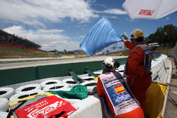 Marshals wave the blue flag