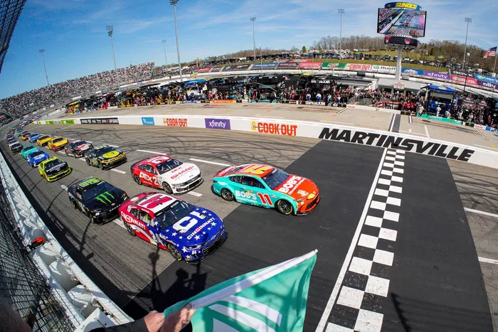 Denny Hamlin leads the field at the start