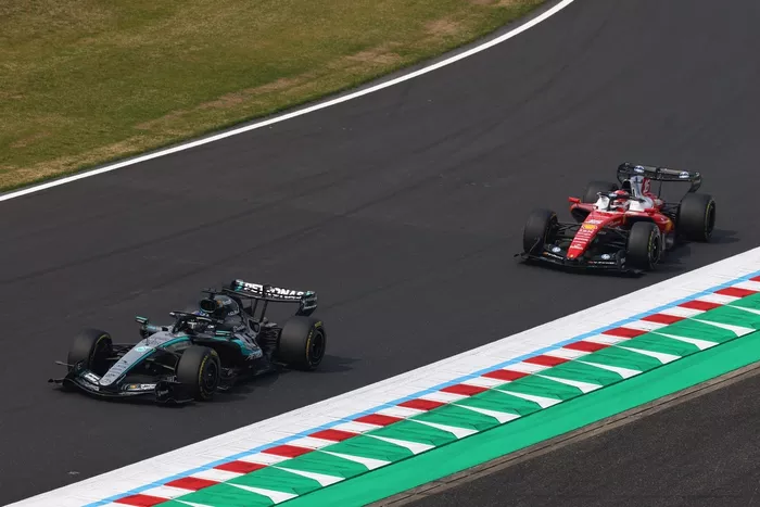 Charles Leclerc, Ferrari; George Russell, Mercedes
