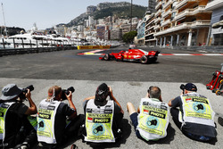 Photographers shoot Sebastian Vettel, Ferrari SF71H