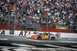 Kevin Harvick takes the checkred flag ahead of Jeff Gordon