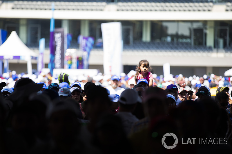 Little girl above the crowd