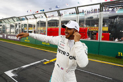 Lewis Hamilton, Mercedes AMG F1, celebrates taking pole position alongside on the pit straight