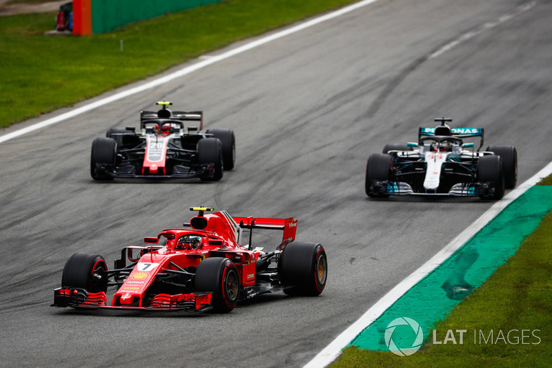 Kimi Raikkonen, Ferrari SF71H, leads Lewis Hamilton, Mercedes AMG F1 W09, and Kevin Magnussen, Haas F1 Team VF-18