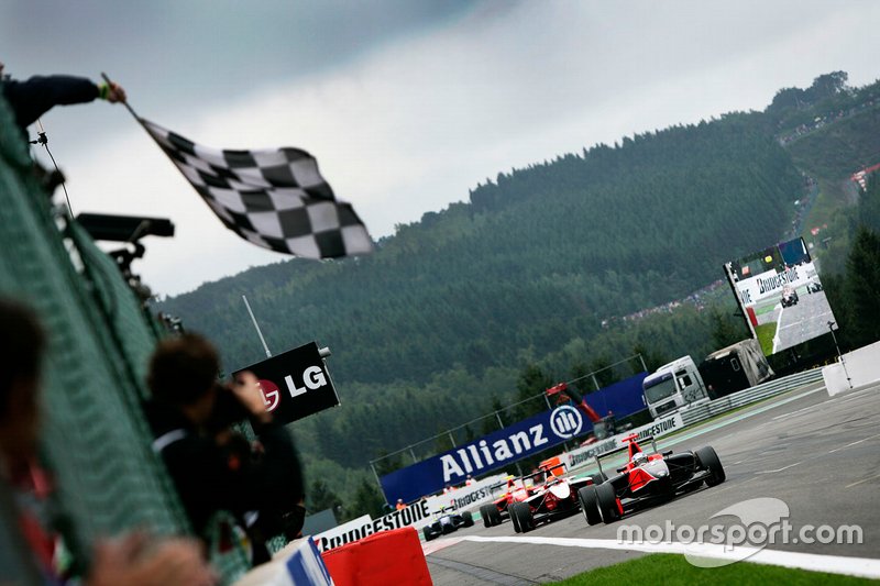 Adrien Tambay, Manor Racing, celebrates victory as he takes the chequered flag in front of Alexander Rossi, ART Grand Prix, and Miki Monras, MW Arden