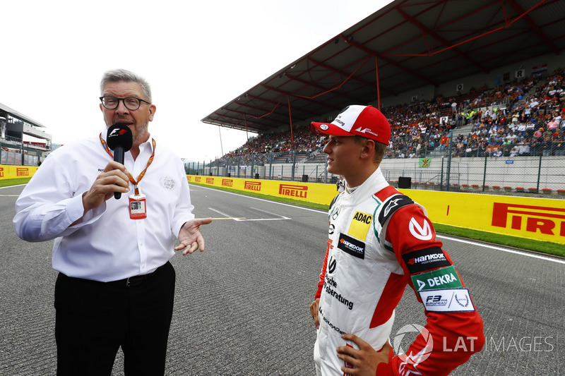 Mick Schumacher talkes to Ross Brawn, Managing Director of Motorsports, FOM