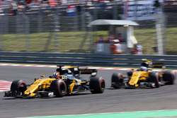 Nico Hulkenberg, Renault Sport F1 Team RS17 passes Jolyon Palmer, Renault Sport F1 Team RS17