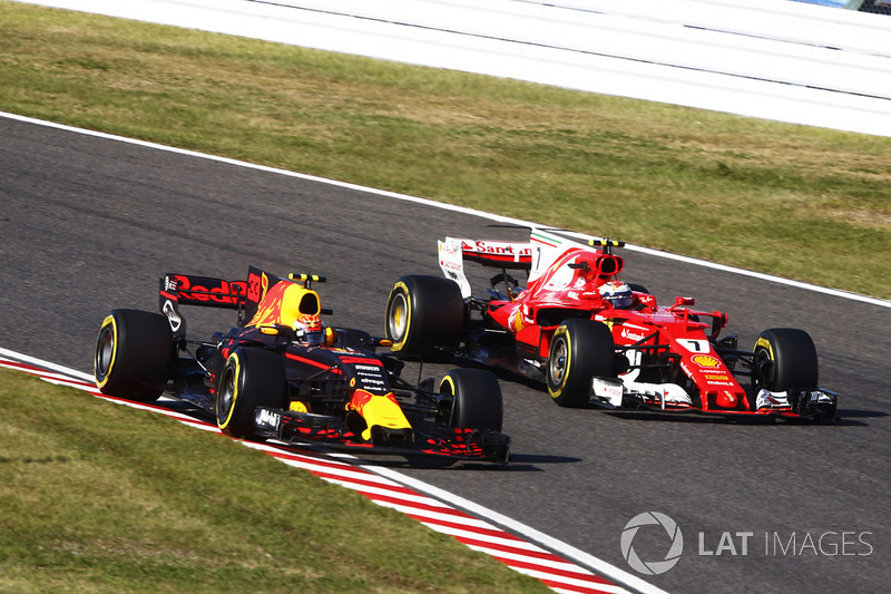 Max Verstappen, Red Bull Racing RB13, battles with Kimi Raikkonen, Ferrari SF70H, after his pit stop