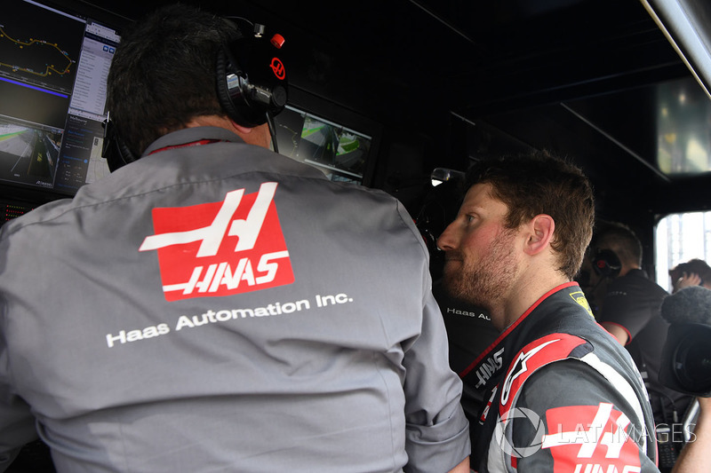 Race retiree Romain Grosjean, Haas F1 and Guenther Steiner, Team Prinicipal, Haas F1 Team