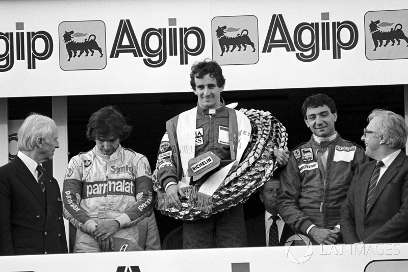 Podium: winnaar Alain Prost, McLaren, tweede Michele Alboreto, Ferrari, derde Nelson Piquet, Brabham