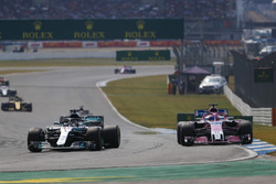 Lewis Hamilton, Mercedes AMG F1 W09, passes Sergio Perez, Force India VJM11