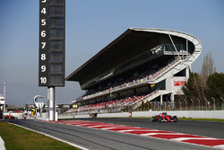 Kimi Raikkonen, Ferrari SF70H passes Carlos Sainz Jr., Scuderia Toro Rosso STR12, as Fernando Alonso