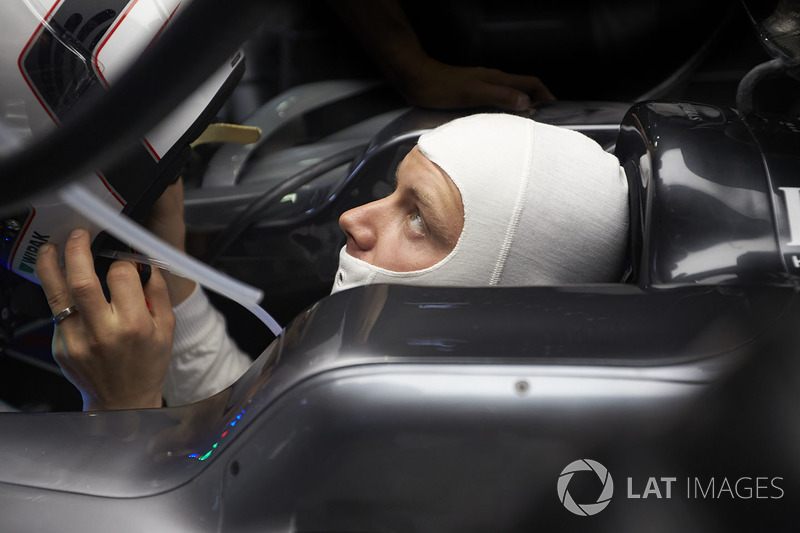 Valtteri Bottas, Mercedes AMG F1, puts his helmet on