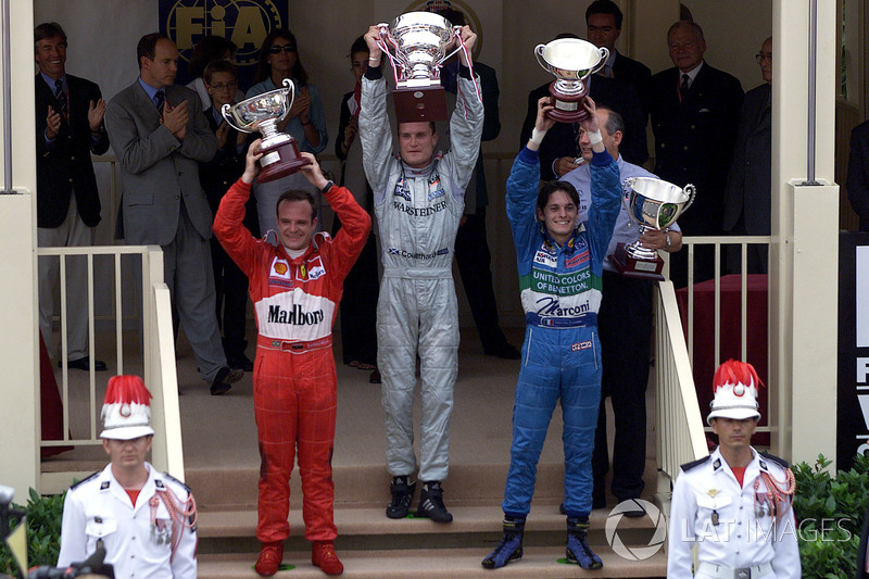 Podium: Race winner David Coulthard, McLaren, second place Rubens Barrichello, Ferrari, third place 