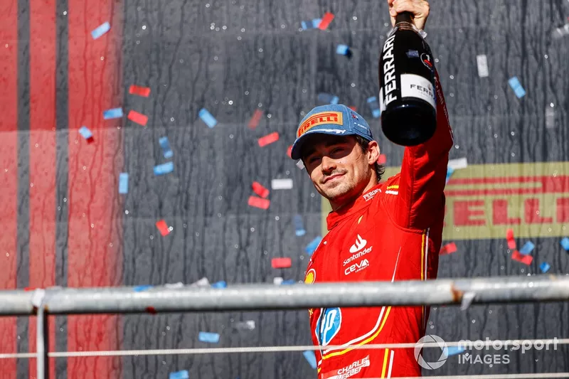 Charles Leclerc, Scuderia Ferrari, 1st position, celebrates on the podium with Champagne