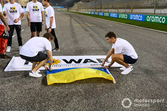 Sebastian Vettel, Aston Martin and George Russell, Mercedes-AMG, wear 