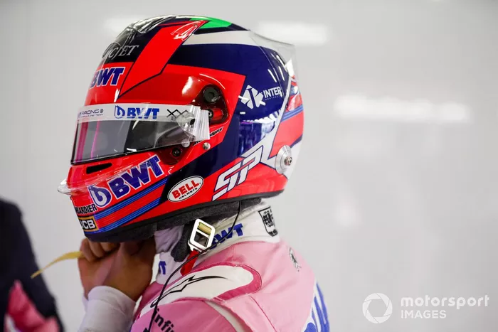 Sergio Pérez, Racing Point, straps his helmet on