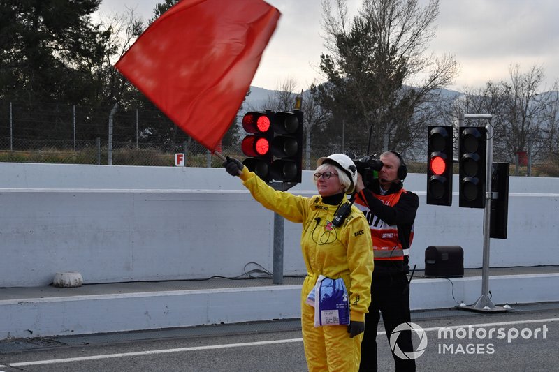 Marshal waves the red flag