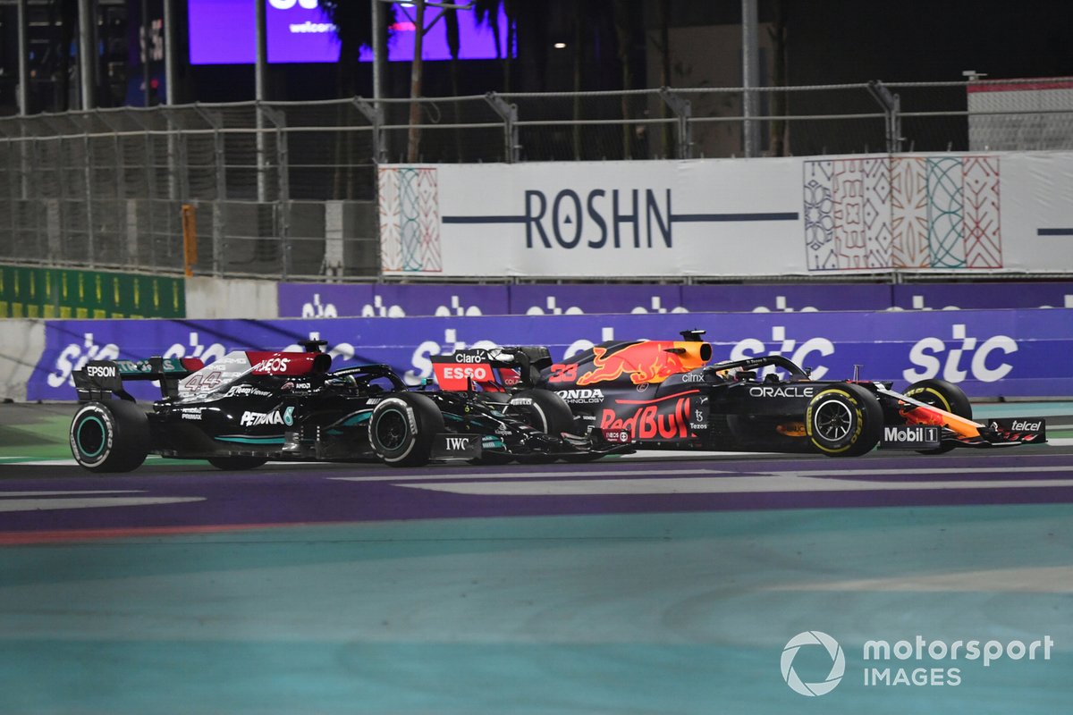 Max Verstappen, Red Bull Racing RB16B, battles with Lewis Hamilton, Mercedes W12