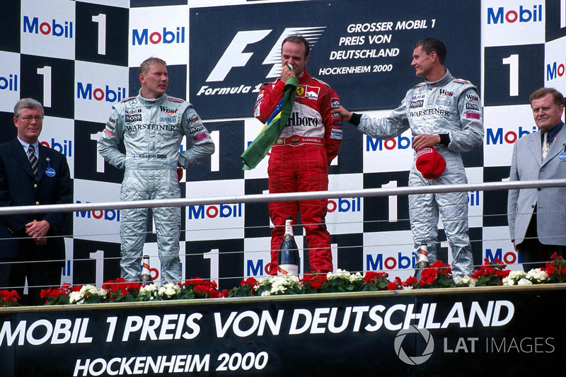 Mika Hakkinen, McLaren 2nd, race winner Rubens Barrichello, Ferrari and David Coulthard, McLaren 3rd