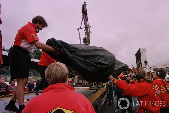 The wreckage of Jacques Villeneuve, Williams is bought back to the pits after his crash