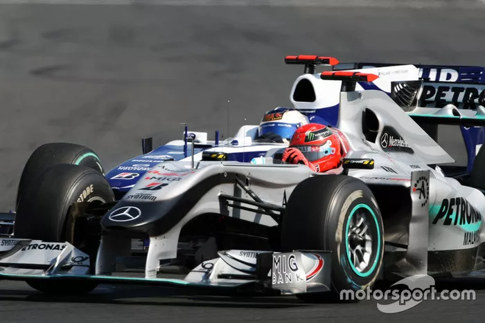 Michael Schumacher, Mercedes GP MGP W01, Rubens Barrichello, Williams FW32