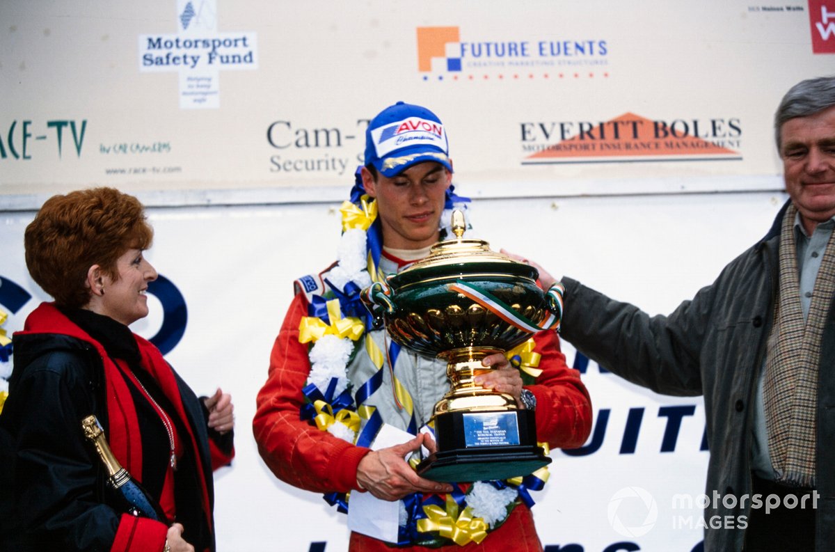 Overall Festival winner Alan van der Merwe is presented with the Neil Shanahan trophy on the podium