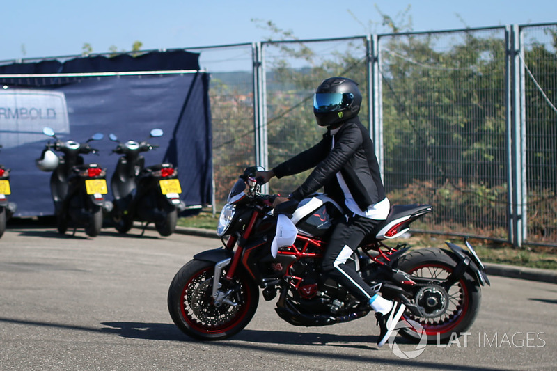 Lewis Hamilton, Mercedes AMG F1 W08 arrives on his MV Agusta Dragster RR LH44 Limited Edition motorbike