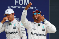 Lewis Hamilton, Mercedes AMG F1 celebrates his pole position in parc ferme with Nico Rosberg, Mercedes AMG F1 (Left)
