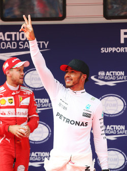 Lewis Hamilton, Mercedes AMG, celebrates pole position ahead of Sebastian Vettel, Ferrari