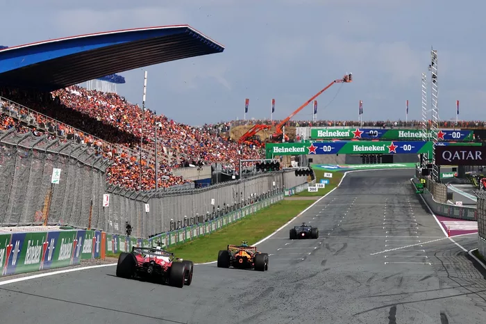 Charles Leclerc, Ferrari; Lando Norris, McLaren