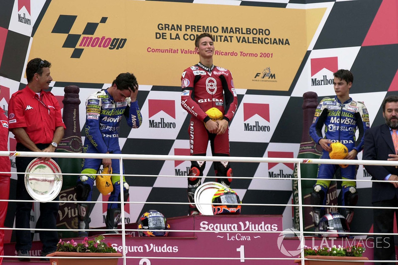 Podium: race winner Manuel Poggiali, second place Toni Elias, third place Dani Pedrosa