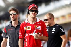 Sebastian Vettel, Ferrari, with Romain Grosjean, Haas F1 Team, and Valtteri Bottas, Mercedes AMG, during the drivers parade