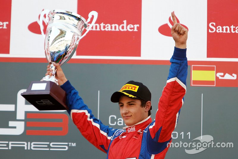 Mitch Evans celebrates victory on the podium