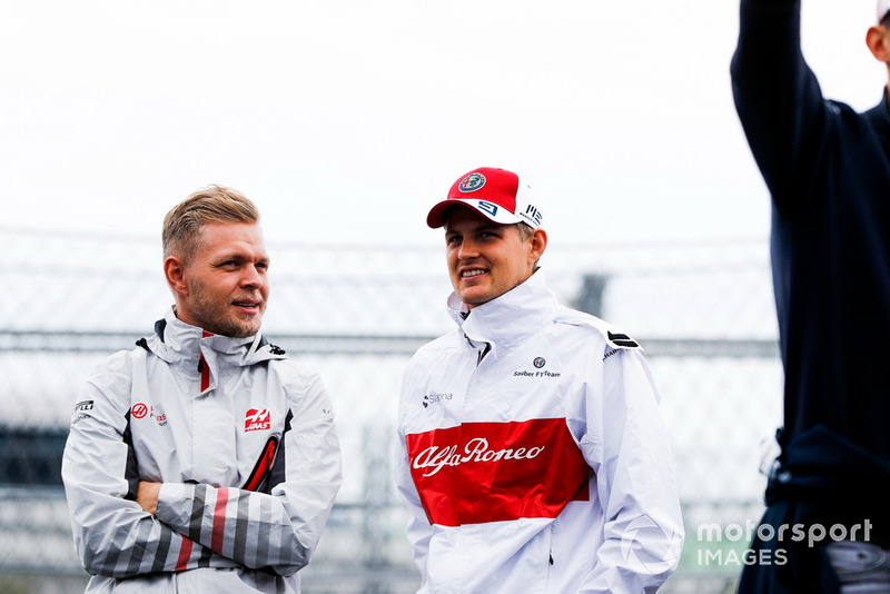 Kevin Magnussen, Haas F1 Team, with Marcus Ericsson, Sauber