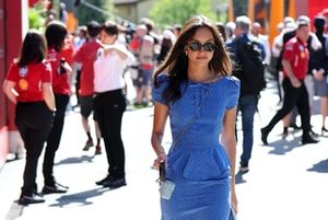 Alexandra Saint Mleux walks in the Paddock with Leo Leclerc 