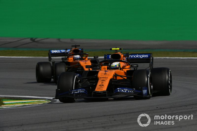 Lando Norris, McLaren MCL34, leads Carlos Sainz Jr., McLaren MCL34