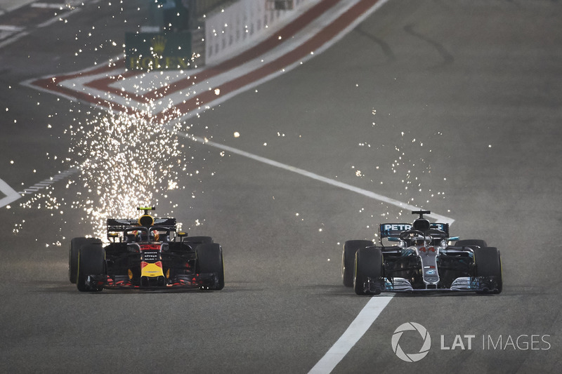 Sparks fly as Max Verstappen, Red Bull Racing RB14 Tag Heuer, battles with Lewis Hamilton, Mercedes AMG F1 W09