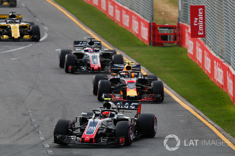 Kevin Magnussen, Haas F1 Team VF-18 Ferrari, leads Max Verstappen, Red Bull Racing RB14 Tag Heuer, R