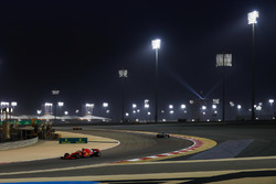 Sebastian Vettel, Ferrari SF71H, leads Valtteri Bottas, Mercedes AMG F1 W09, and Kimi Raikkonen, Fer