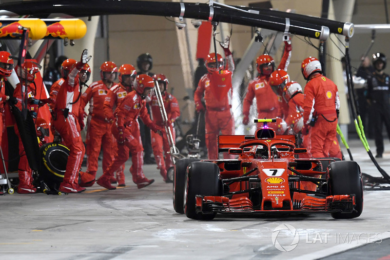 Kimi Raikkonen, Ferrari SF71H hits a mechanic as he leaves the pits