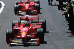 Race winner Michael Schumacher, Ferrari, second place Eddie Irvine, Ferrari
